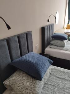 Postel nebo postele na pokoji v ubytování Apartamenty CITI