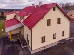 an aerial view of a house with a red roof at Penzion Hlinky 