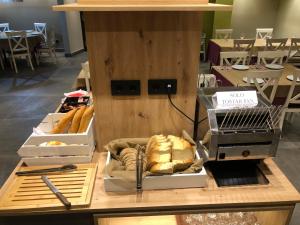 a table with boxes of bread on top of it at HOTEL MONTE PERDIDO in Bielsa