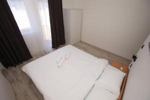 Postel nebo postele na pokoji v ubytování Vurk INN Paracin