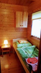 Postel nebo postele na pokoji v ubytování VERANO DOMKI
