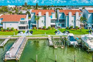 a house on the water with a marina at Madeira Beach Yacht Club #G in St Pete Beach