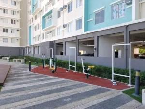 a large building with a red carpet in front of it at One Spatial Iloilo Two Bedroom Condominium Unit with Pool and Gym in Iloilo City