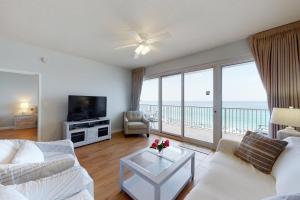 a living room with a view of the ocean at TOPS'L Tides 704 in Destin