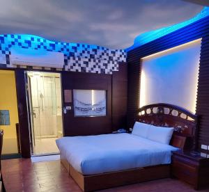 Postel nebo postele na pokoji v ubytování Keton Motel Hualien