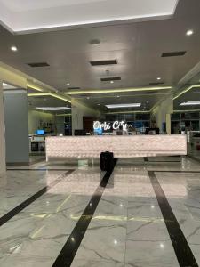 a suitcase sitting on the floor of an airport terminal at Hotel Orbi city in Batumi