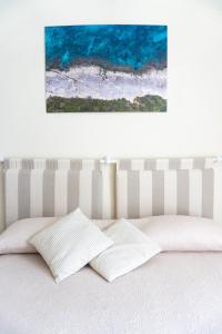 Postel nebo postele na pokoji v ubytování Notos b&b