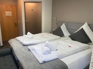 Postel nebo postele na pokoji v ubytování Hotel Il David