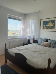 A bed or beds in a room at Summer Vibe Siofok
