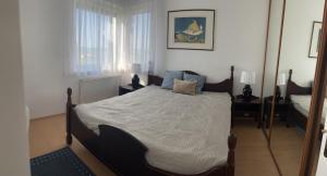 A bed or beds in a room at Summer Vibe Siofok