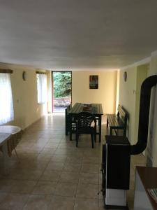 a living room with a table and chairs in it at Chata Slapy Skalice 2 in Slapy