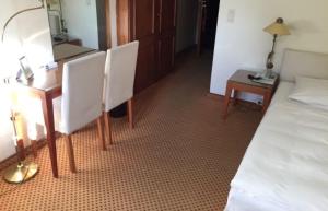 Postel nebo postele na pokoji v ubytování Meyers Hotel Hittfeld