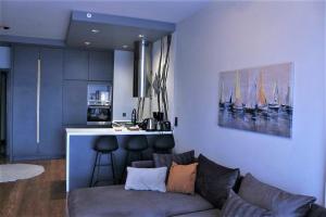 a living room with a couch and a kitchen at BENESTA BEYOGLU in Istanbul