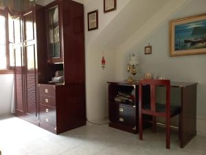 a room with a desk and a table and a chair at Domus Garden in Olbia +33 photos