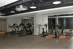 a gym with several treadmills and exercise bikes at BENESTA BEYOGLU in Istanbul