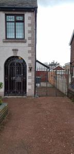 an entrance to a building with an iron gate at ST ANNES PROFESSIONAL LET - BLACKPOOL in Blackpool