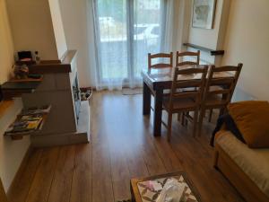 a living room with a dining room table and chairs at Montes de Lillo --Vut LE 625 in Puebla de Lillo