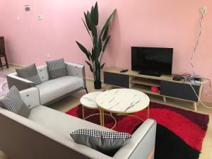 Μια τηλεόραση ή/και κέντρο ψυχαγωγίας στο Cozy Homestay Che Yang