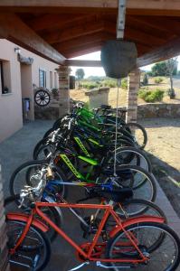 a row of bikes parked next to a building at AGRITURISMO Costa Verde in Arbus