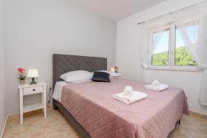 Posteľ alebo postele v izbe v ubytovaní Apartments Bjelis + 37 fotografií