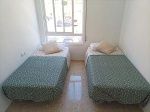 Postel nebo postele na pokoji v ubytování Duplex céntrico con piscina a 100m de la playa.