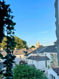 a view of a city with houses and a church at 3-Bed Luxe Truro Townhouse Gem. Escape in Style! in Truro