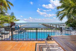 a view of the ocean from the balcony of a resort at Keys Oceanfront Beauty Dock and pool in Marathon