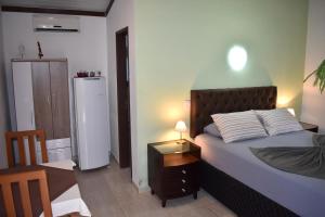Postel nebo postele na pokoji v ubytování Hotel Pousada Rancho Fundo