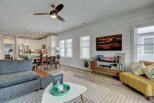 a living room with a couch and a table at Oasis at the Beach in Carolina Beach