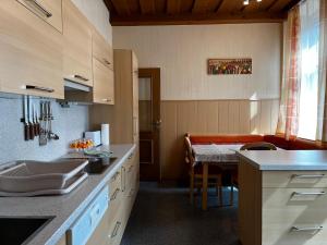 a kitchen with a table and a dining room at Palma Apartment in Schottwien