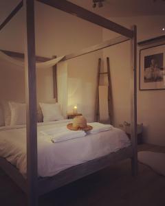 a teddy bear sitting on top of a bed at Fig&Olive Luxury one bedroom boutique in Pachna in Limassol