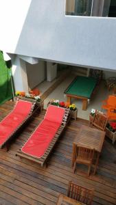 a model of a deck with chairs and a table at Pousada Caravela in Arraial do Cabo