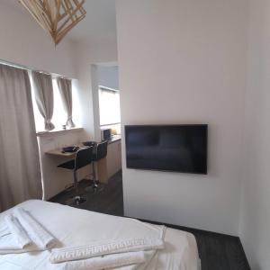 Televízia a/alebo spoločenská miestnosť v ubytovaní PETMEZA APARTMENT 2 Aigio City F