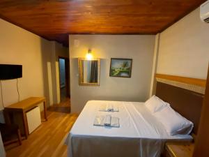 a bedroom with a white bed with two plates on it at Herton Boutique Hotel in Istanbul