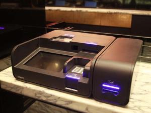 a computer printer sitting on a table on a counter at APA Hotel Yodoyabashi Ekimae in Osaka