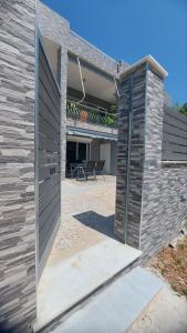 an open door to a house with a patio at Plaza House in Kanáki +18 photos