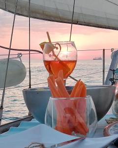 a table with a bowl of food on a boat at La tua stanza a vela sul mare in Bari