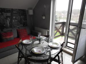 Posedenie v ubytovaní Apartament Jaśkowy