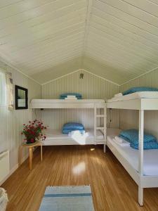 a room with two bunk beds in a house at Aspnes Camping AS in Mosjøen