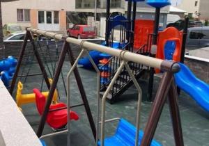 a playground with a blue and red slide at Studio Philip by Alezzii Nord 10 in Năvodari