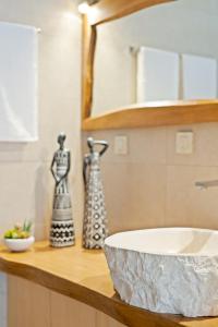a bathroom counter with a sink and a mirror at The Violin House in Chania +11 photos
