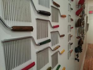 a wall with many different types of handles on it at Ray's Bucktown Bed and Breakfast in Chicago