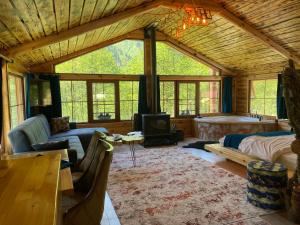 a living room with a couch and a fireplace at smailoberj in Ayder Yaylasi