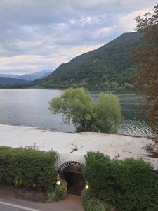 a view of a body of water with a bridge at CasaEndine in Ranzanico +13 photos
