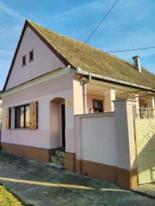 a small white house with a garage at Holiday house with a parking space Orolik, Slavonija - 14358 in Privlaka