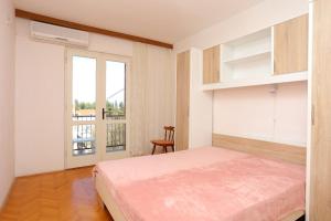 Posteľ alebo postele v izbe v ubytovaní Apartment Supetar 16656b