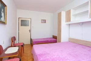 Postel nebo postele na pokoji v ubytování Apartment Supetar 16656b