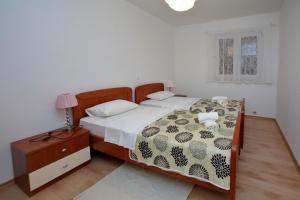 Postel nebo postele na pokoji v ubytování Apartments with a parking space Sukosan, Zadar - 16641