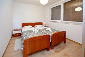 Posteľ alebo postele v izbe v ubytovaní Apartments with parking spaces Sukosan, Zadar - 16641