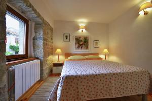 a bedroom with a bed and a window at Holiday house with WiFi Paz, Central Istria - Sredisnja Istra - 16623 in Buzet